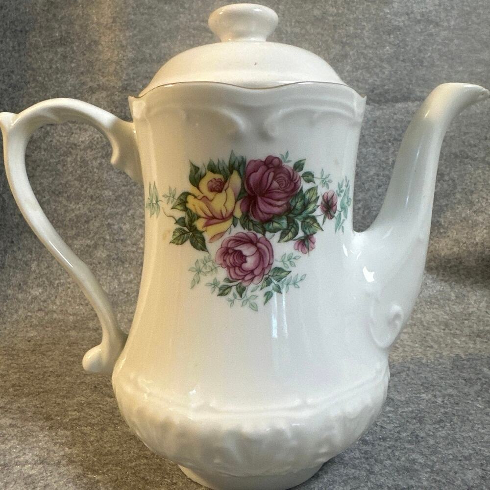 Vintage Włocławek porcelain teapot from Poland featuring a colorful floral rose